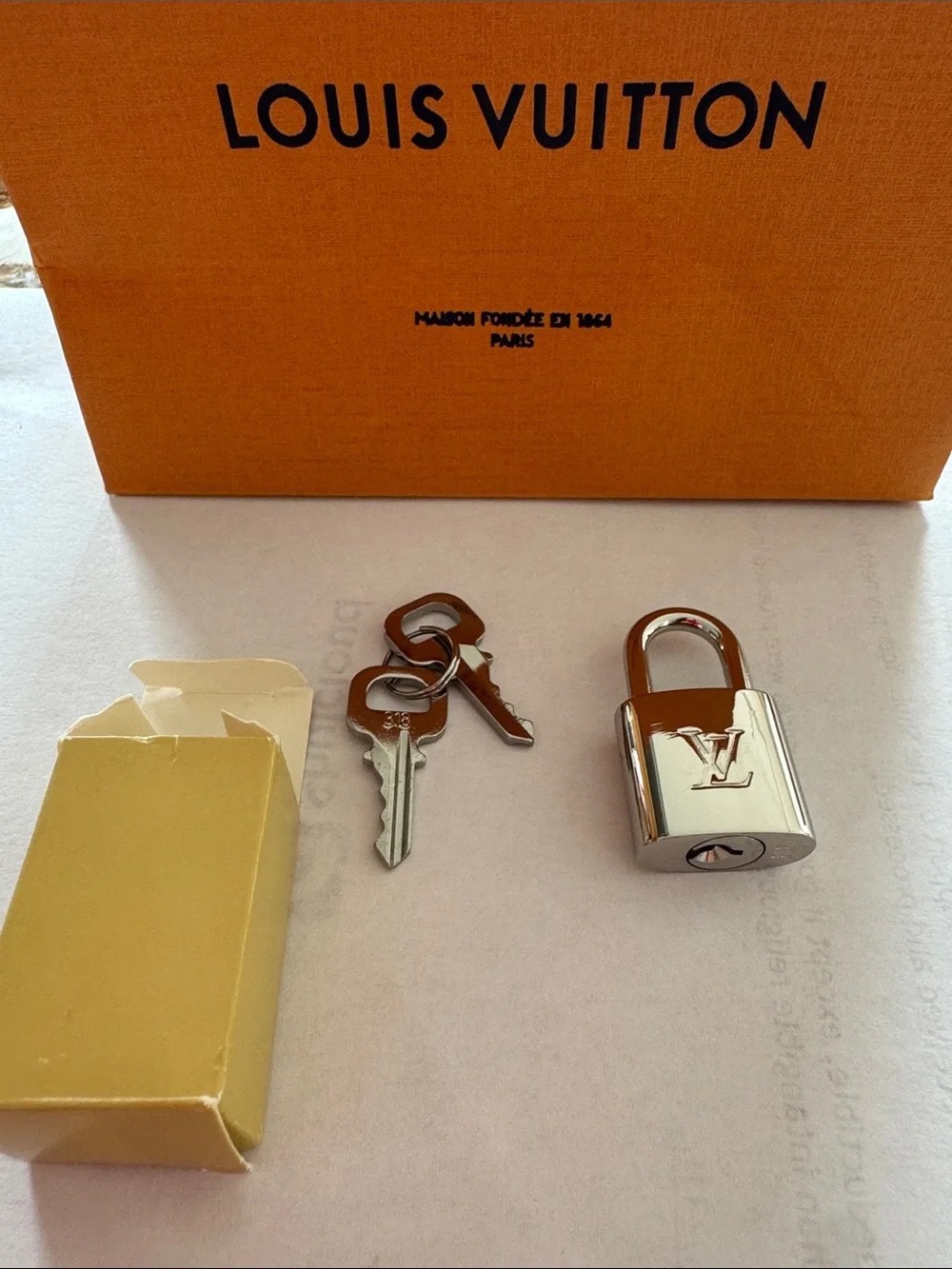 Louis Vuitton Silver Padlock and Key Set